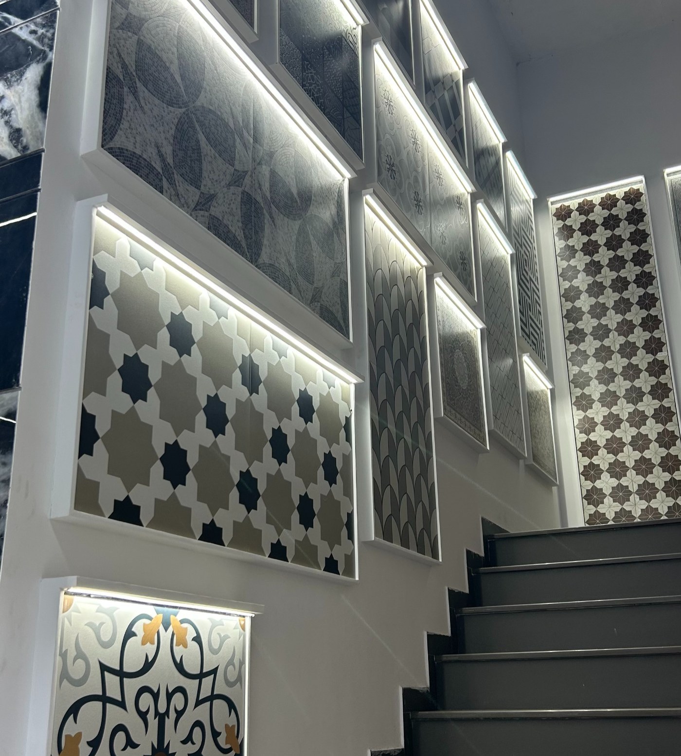 Backlit staircase tile gallery at HCS Home's showroom in Ambala